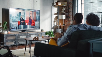 Netflix Has Released 28 Seasons of Its Sales Growth Series. What Will Season 29 Look Like?: https://g.foolcdn.com/editorial/images/856226/tv-watching-getty.jpg