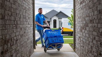 This Top Dividend Stock Just Joined Meta, Tesla, Broadcom, and Berkshire Hathaway in the $1 Trillion Club: https://g.foolcdn.com/editorial/images/855385/walmart-delivery-person-with-order.jpg