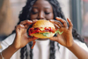 Will the Wendy's Turnaround Actually Work?: https://g.foolcdn.com/editorial/images/855598/woman-eating-cheeseburger.jpg