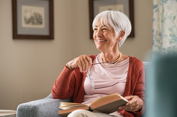 The No. 1 Reason to Claim Social Security at Age 62: https://g.foolcdn.com/editorial/images/855228/senior-woman-smiling-book-gettyimages-1316201778.jpg