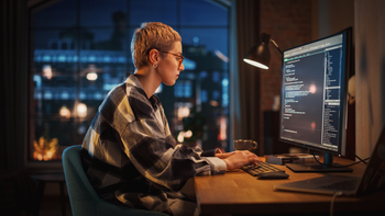 1 Growth Stock Down 32% to Buy Hand Over Fist in February, According to Wall Street: https://g.foolcdn.com/editorial/images/855861/a-computer-programmer-working-at-a-desk-in-an-apartment.jpg