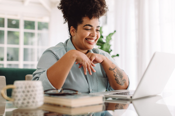 Prediction: Buying This Vanguard ETF Today Could Set You Up for Life: https://g.foolcdn.com/editorial/images/856162/person-using-a-laptop-and-smiling.jpg