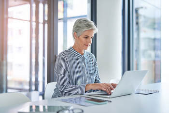 Pushed Into Early Retirement? 2 Immediate Moves to Make: https://g.foolcdn.com/editorial/images/855609/woman-older-laptop-gettyimages-1152601629.jpg
