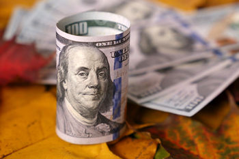 1 Beaten-Down Value Stock to Buy Now With $100: https://g.foolcdn.com/editorial/images/856355/gettyimages-100-dollar-bill-rolled-up.jpg
