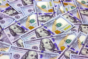 Better Dividend Stock: Oneok vs. Kinder Morgan: https://g.foolcdn.com/editorial/images/853772/cash-money-hundred-dollar-bills.jpg