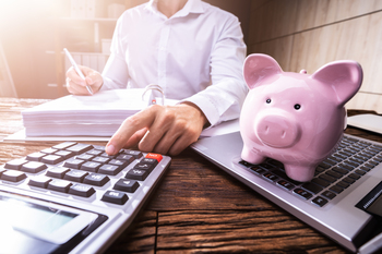 Can COLAs Really Keep Up With Inflation? Why I'm Not Relying on Social Security Alone in Retirement.: https://g.foolcdn.com/editorial/images/853923/piggy-bank-investing-math-on-calculator.jpg