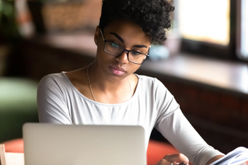 Is GoDaddy a Hidden Value Stock?: https://g.foolcdn.com/editorial/images/855524/young-woman-researches-on-a-computer.jpg