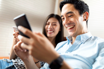 Prediction: These Could Be the Best-Performing Bank Stocks Through 2030: https://g.foolcdn.com/editorial/images/853866/2-people-looking-at-phones-and-smiling.jpg