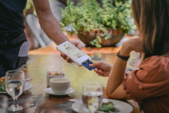 What I'm Watching With Fiserv to See if It Beats the Market: https://g.foolcdn.com/editorial/images/855420/fiserv-closer-transaction-at-a-restaurant.png