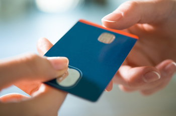 3 Predictions for American Express in 2026: https://g.foolcdn.com/editorial/images/854766/credit-card-being-passed-between-two-hands-authorized-user-purchase-transaction.jpg