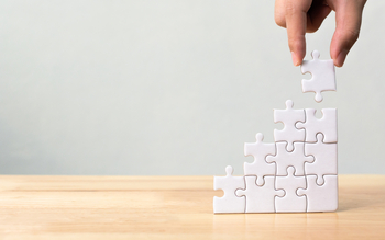 Toronto-Dominion Bank Could Soar If These 3 Things Go Right: https://g.foolcdn.com/editorial/images/855425/25_03_02-a-hand-building-a-puzzle-vertically-_mf-dload-gettyimages-1054149870-1200x750-7d59391.jpg