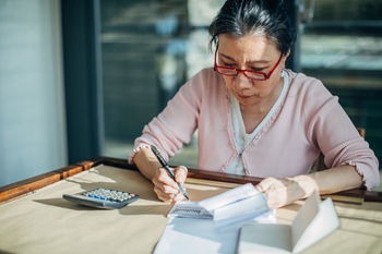 Here's Why Planning Not to Retire Could Come Back to Bite You: https://g.foolcdn.com/editorial/images/857709/woman-reviewing-calculating-studying.jpg