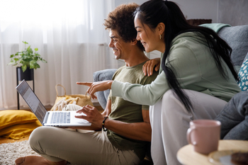 Why Shares of IonQ Are Soaring This Week: https://g.foolcdn.com/editorial/images/858055/two-smiling-investors-look-at-laptop.jpg
