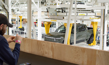 Rivian Stock Is Outrageously Cheap, but Does That Make It a Buy Now?: https://g.foolcdn.com/editorial/images/855133/truck-on-assembly-line-while-employee-looks-at-it-from-a-distance_rivian.jpg