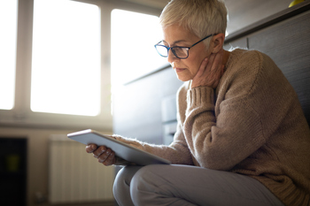 Facing an RMD Penalty? Here's How You Can Get It Reduced: https://g.foolcdn.com/editorial/images/858372/senior-woman-holding-tablet-gettyimages-1133256480.jpg