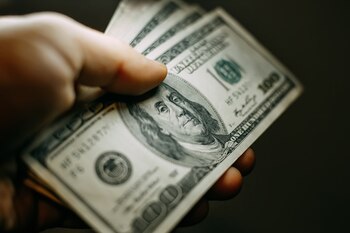 Is MPLX Stock Going to $100?: https://g.foolcdn.com/editorial/images/857593/a-hand-holding-100-bills.jpg
