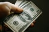 Is MPLX Stock Going to $100?: https://g.foolcdn.com/editorial/images/857593/a-hand-holding-100-bills.jpg