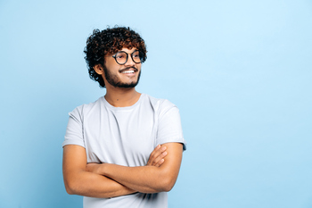 The Sleeper Financial Stock That Could Surge Before Wall Street Notices: https://g.foolcdn.com/editorial/images/853037/getty-arms-crossed-millennial-happy-smiling.jpg