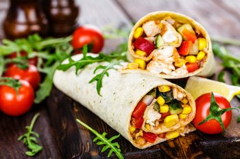 Why Did Chipotle Mexican Grill Stock Drop Today?: https://g.foolcdn.com/editorial/images/859693/burrito-cut-in-half-amid-pile-of-garnish-and-tomatoes.jpg