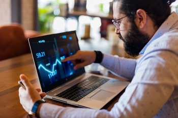 Nvidia and Meta Platforms Are Now Cheaper Than the S&P 500. Which "Magnificent Seven" Stock Is the Best Buy in March?: https://g.foolcdn.com/editorial/images/859116/an-investor-sitting-in-front-of-a-laptop-computer-looking-at-a-stock-market-chart.jpg